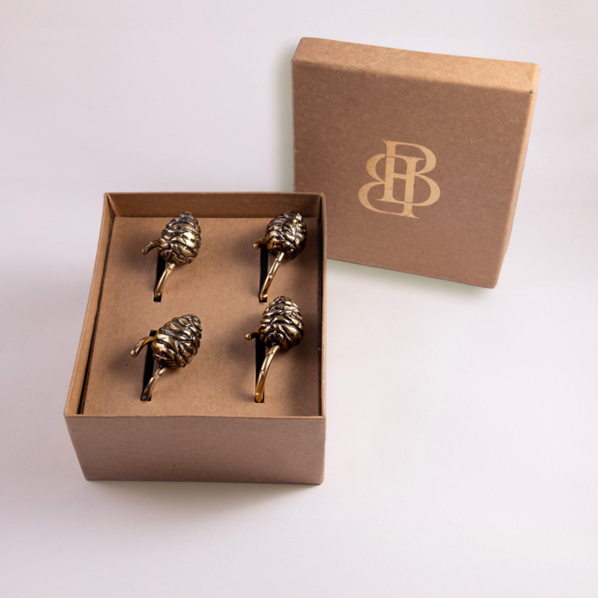 Himalayan Golden Pine Cone Charm Napkin Ring | Set of 4
