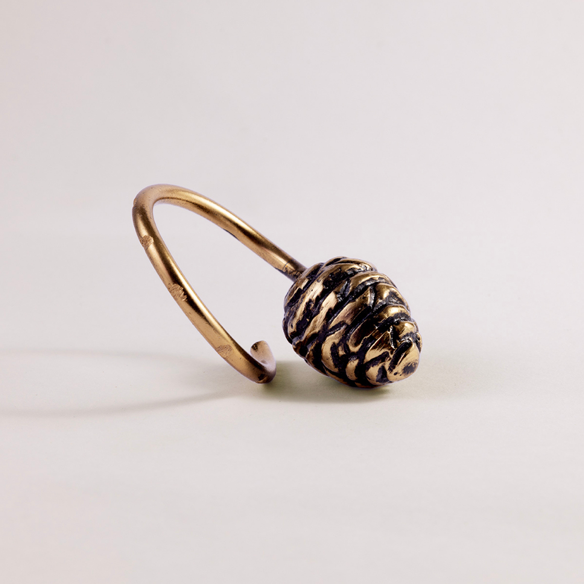 Himalayan Golden Pine Cone Charm Napkin Ring | Set of 4