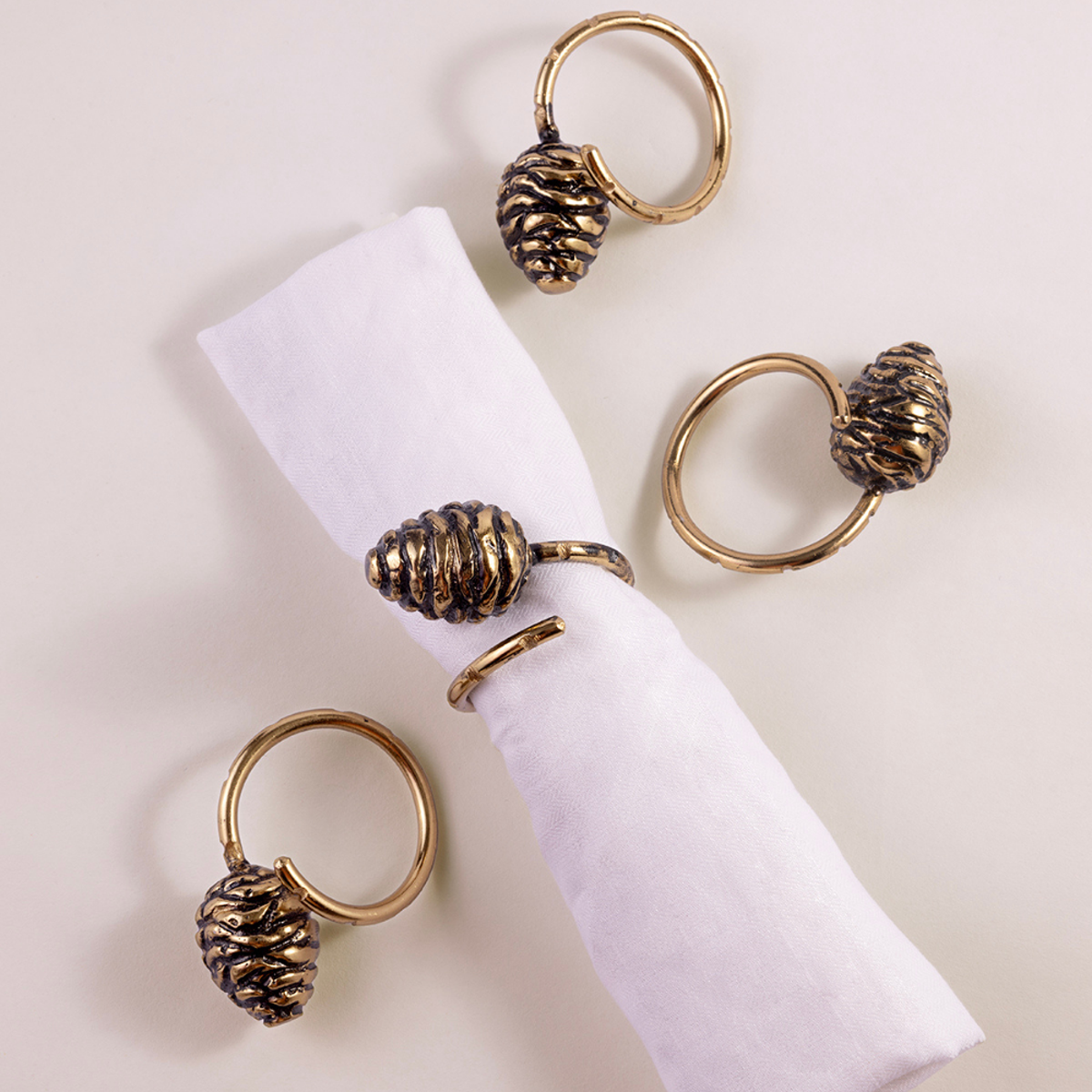 Himalayan Golden Pine Cone Charm Napkin Ring | Set of 4