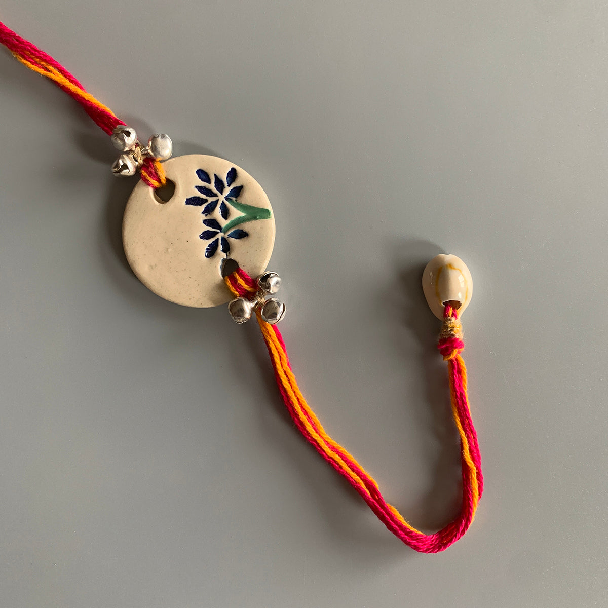 Handmade Ceramic Rakhi | Cotton Threads-White, Red, Yellow